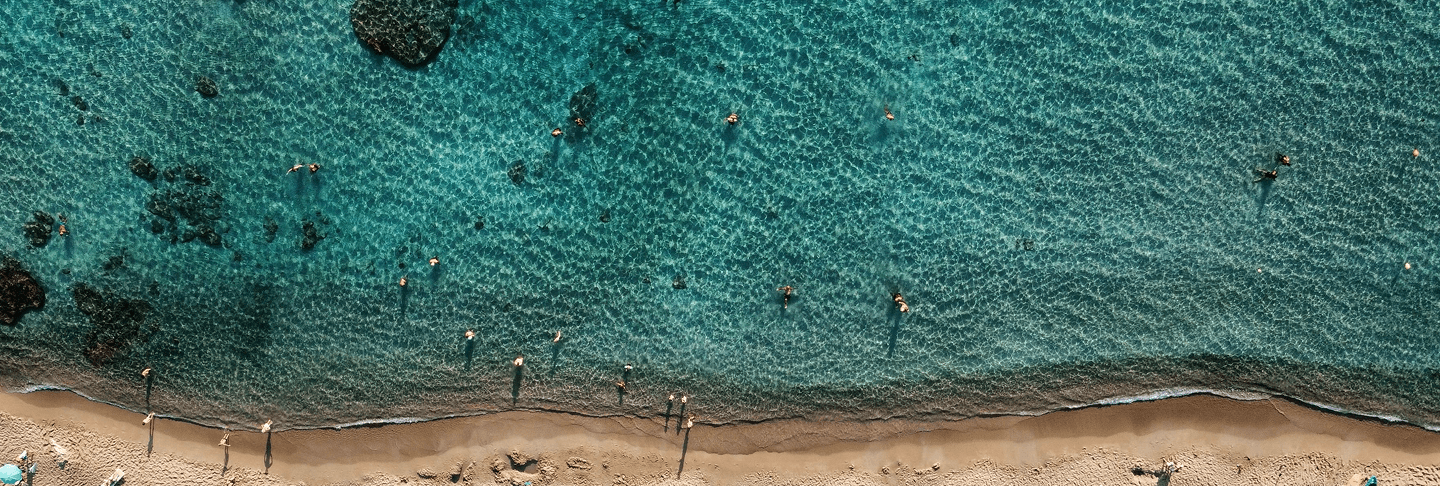 Aerial view of Crete's rocky coastline and turquoise sea